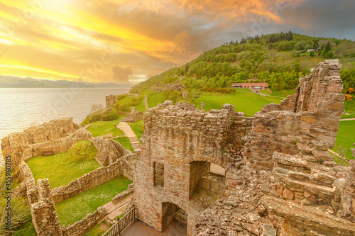 Fotografi top view of Urquhart Castle at sunset beside Loch Ness in Scotland, United Kingdom