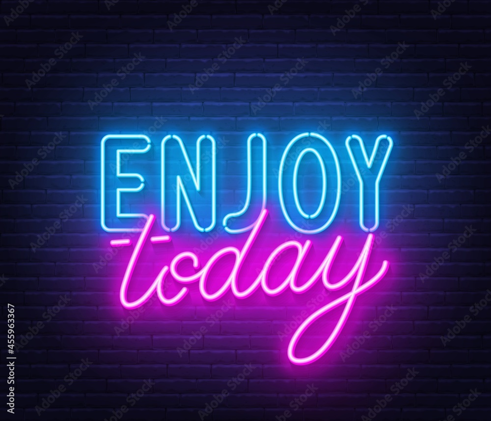 Enjoy today neon lettering on brick wall background.