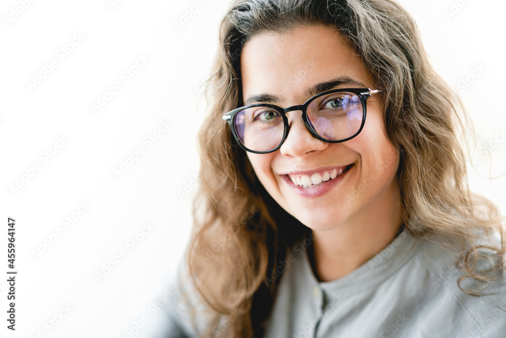 Portrait of young confident caucasian businesswoman in eyeglasses looking at the camera smiling. Entrepreneurship for better quality of life, isolated