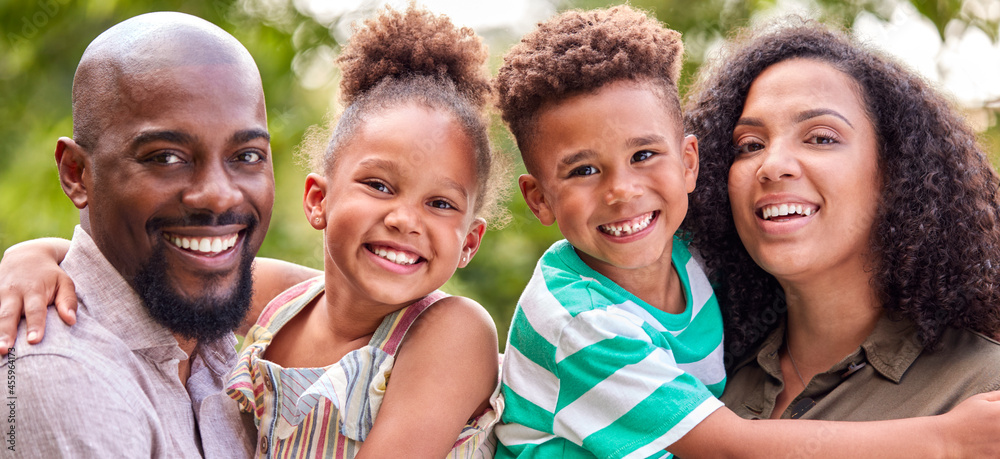 Portrait Of Smiling Family At Home Outdoors In Garden Together Portrait Of Smiling Family At Home Outdoors In Garden Together