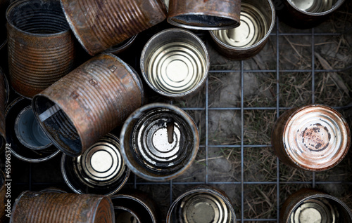 Closeup of group of old tin cans