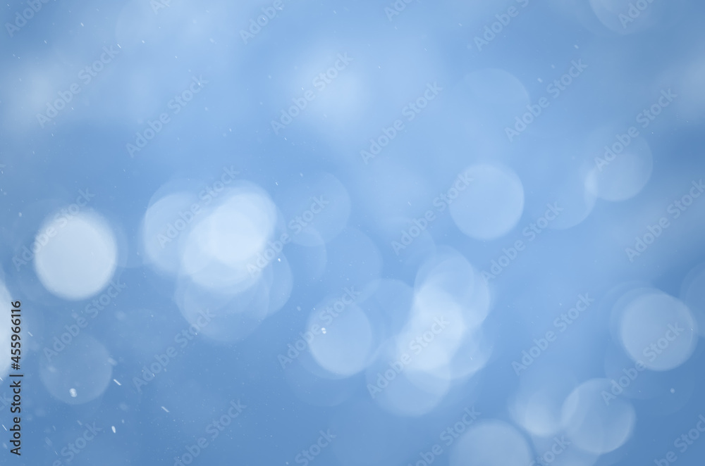 blurry abstract winter background with falling snow