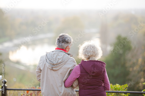 Affectionate active senior couple at autumn park pond © KOTO