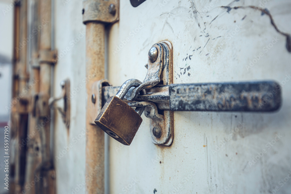 Locked clasp and padlock on a Storage Container sea Locked clasp and padlock on a Storage Container sea