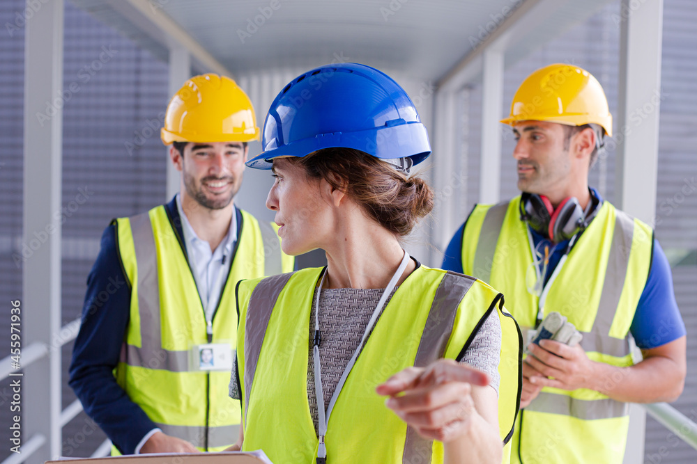 Supervisors and worker with clipboard in factory Supervisors and worker with clipboard in factory