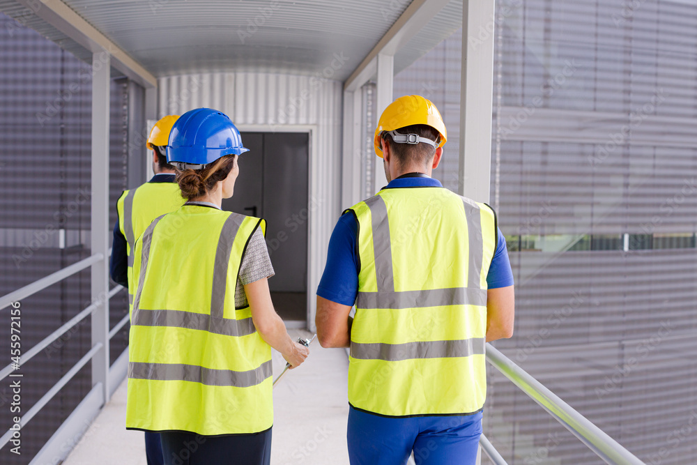 Supervisors and worker talking in factory Supervisors and worker talking in factory