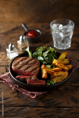 Beef steak with roasted potato and salad