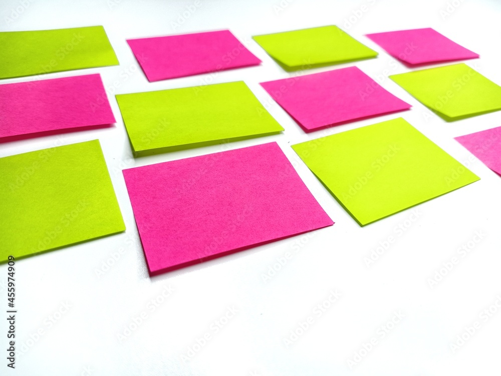 two color post-it on a white board. two color post-it on a white board.