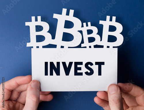 Hands holding a bitcoin cryptocurrency invest sign photo