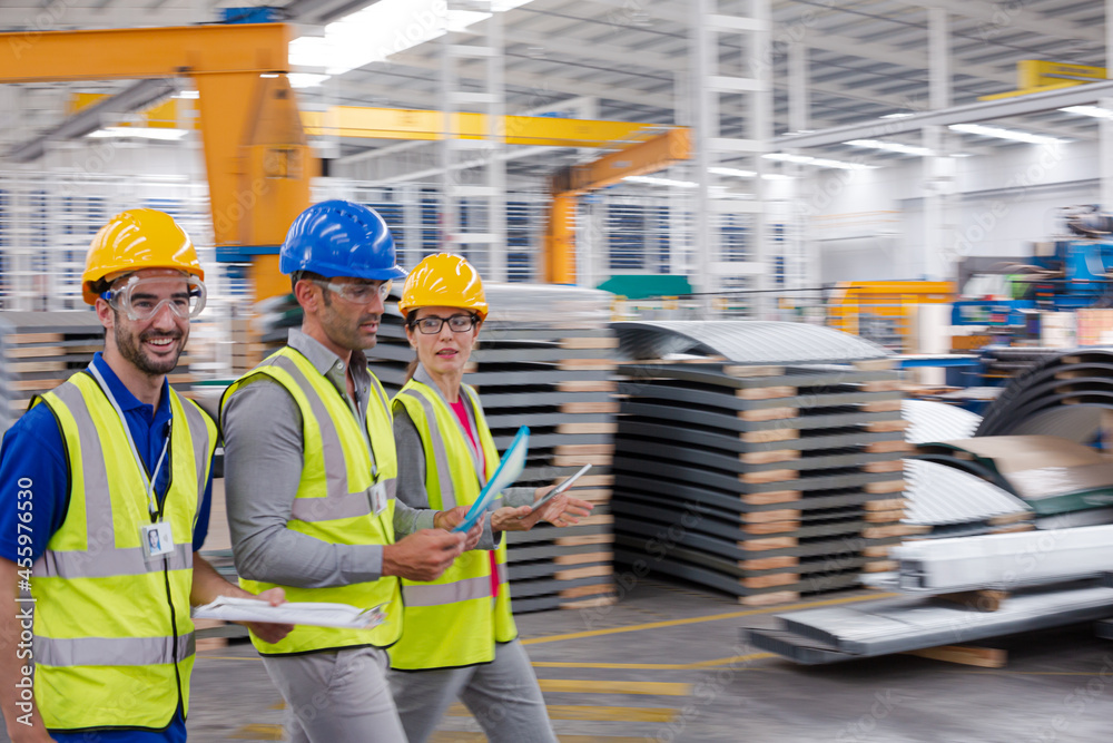 Supervisor and workers talking in warehouse Supervisor and workers talking in warehouse