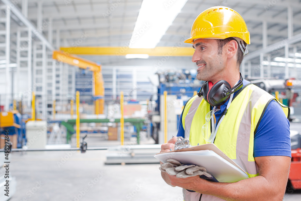 Fototapeta premium Portrait confident worker with clipboard in steel factory