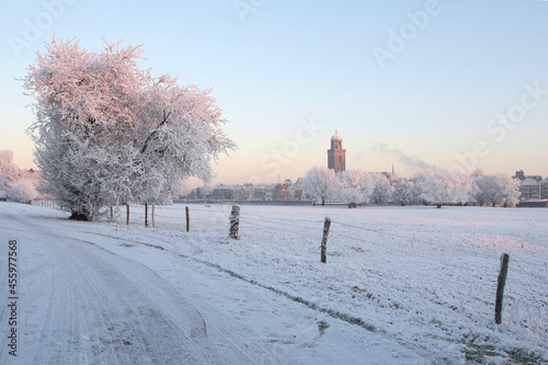 View on the city of Deventer, the Netherlands, on a cold day in winter with snow and frost photo