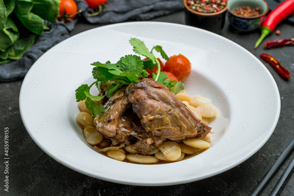 Lamb stewed with lima beans chinese cuisine on dark stone table Lamb stewed with lima beans chinese cuisine on dark stone table