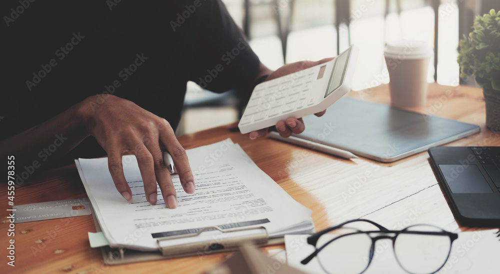 Man calculating financial chart for investment to buying property with house model. Money Saving Concept Man calculating financial chart for investment to buying property with house model. Money Saving Concept