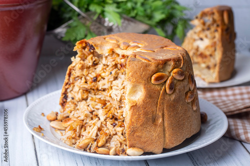 Turkish Perde Pilavi. Drape pilaf with chicken, almond and raisin. A local flavor Rice from Siirt region (Turkish name; Siirt perde pilavi) photo