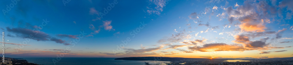 Panoramic view of the amazing sunset sky over the sea.