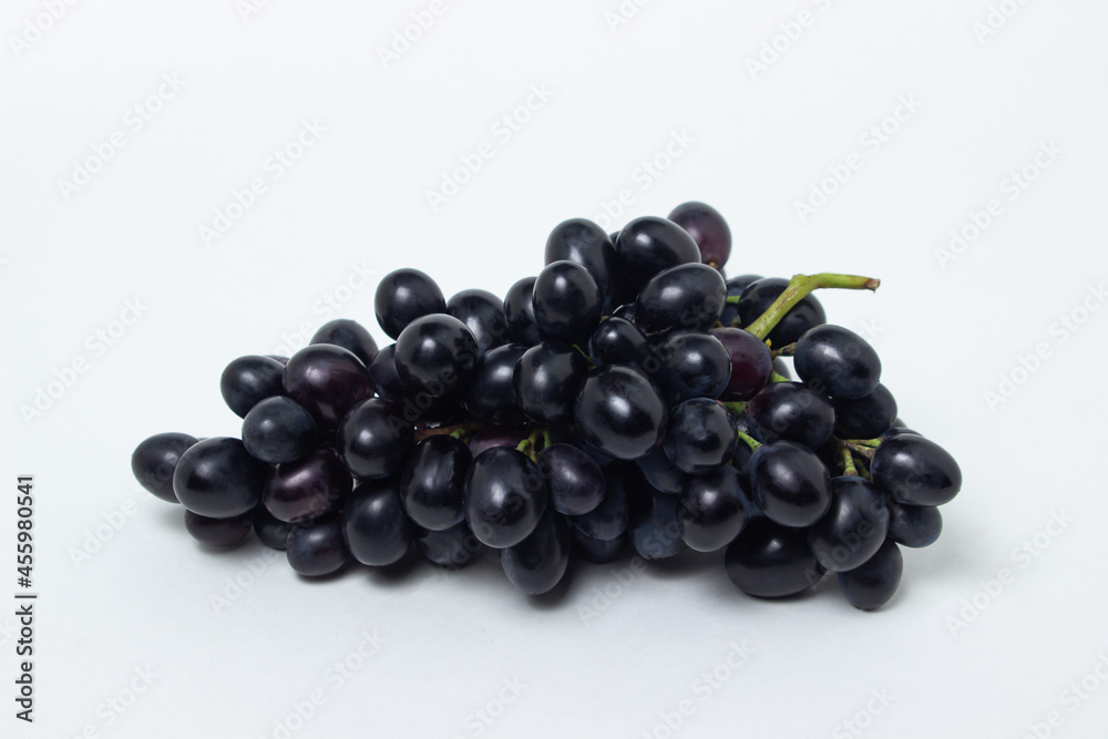 Black grapes on a white background. Fresh juicy grapes Black grapes on a white background. Fresh juicy grapes
