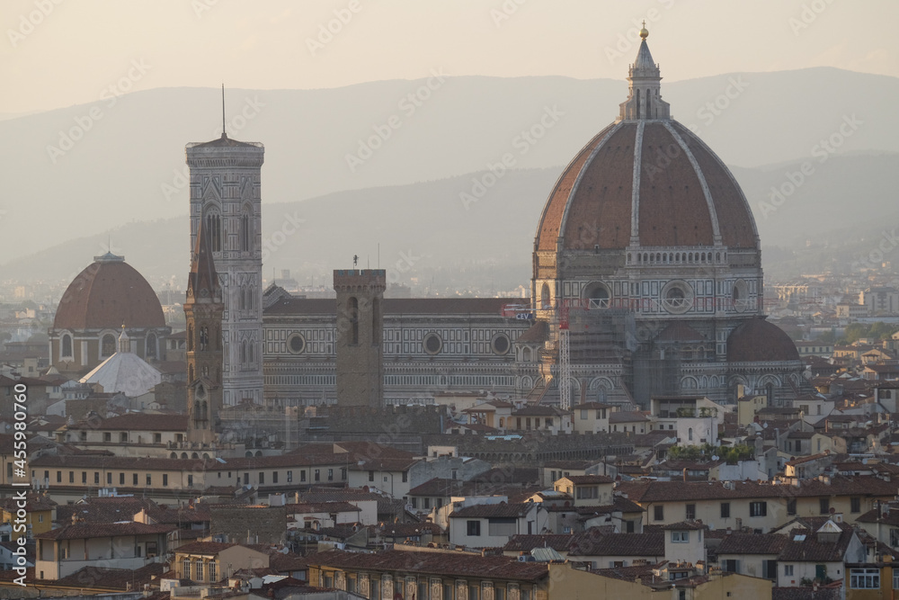 Panoramic view of the Cathedral, La Catterdrale di Santa Mariadel Fiore from a hillin the rays of setting sun, Florence, Italy