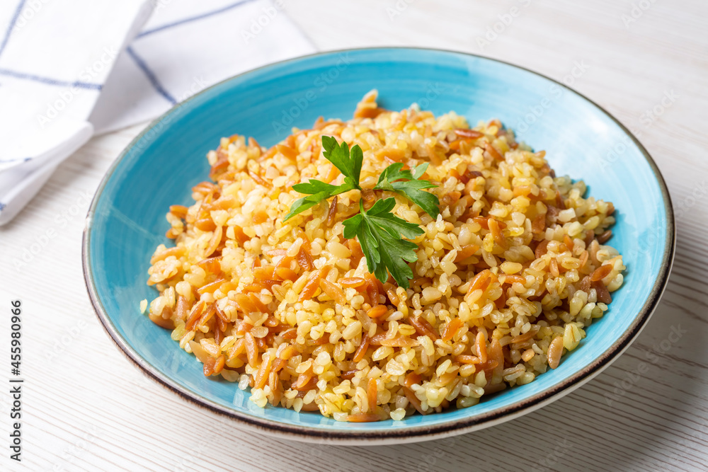 Traditional delicious Turkish food, bulgur pilaf with vermicelli (Turkish name; arpa sehriyeli bulgur pilavi) Traditional delicious Turkish food, bulgur pilaf with vermicelli (Turkish name; arpa sehriyeli bulgur pilavi)