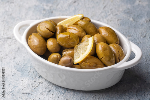 Cracked green olives. Crack...