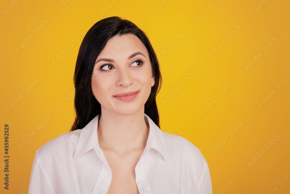 Portrait of dreamy inspired girl look up empty space on yellow background Portrait of dreamy inspired girl look up empty space on yellow background