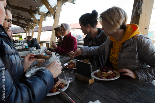 Couple sharing breakfast at restaurant outdoor patio