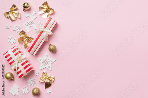 New Year composition. Christmas decor background with gift boxes. Top view with copy space