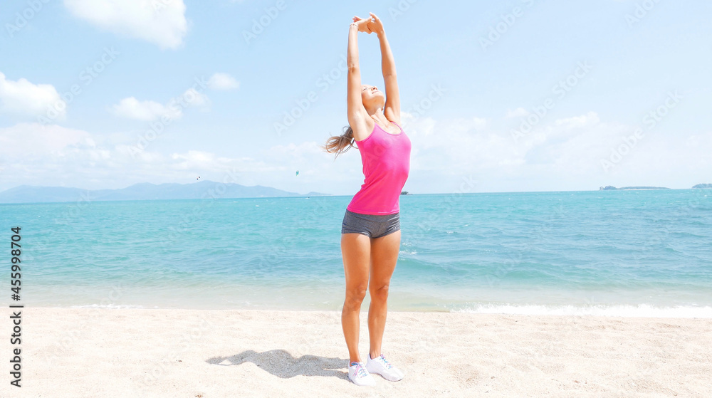 Fitness sport woman running on beach outside at sunset. Healthy lifestyle image of beautiful young asian woman jogging on black sand beach. Fitness sport woman running on beach outside at sunset. Healthy lifestyle image of beautiful young asian woman jogging on black sand beach.