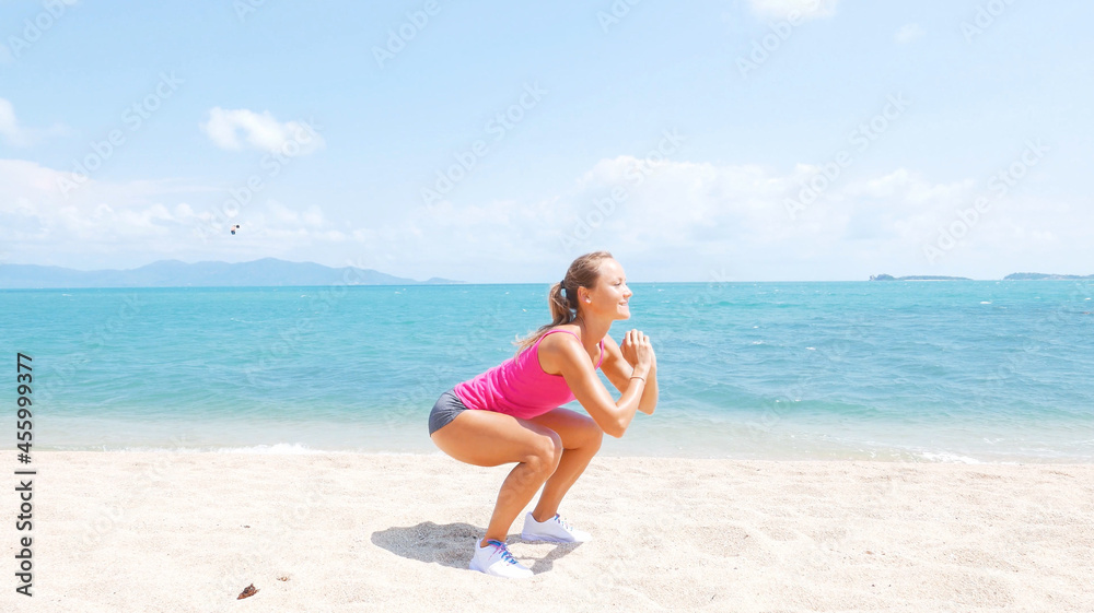 Fitness sport woman running on beach outside at sunset. Healthy lifestyle image of beautiful young asian woman jogging on black sand beach.