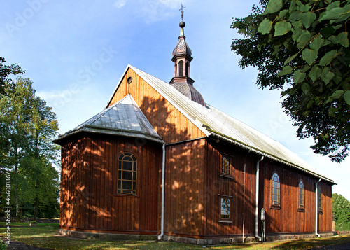 General view and architectural details of the belfry and the wooden Catholic church of St. Andrew Bobola built in 1938 in the village of Skierkowizna in Mazovia, Poland.