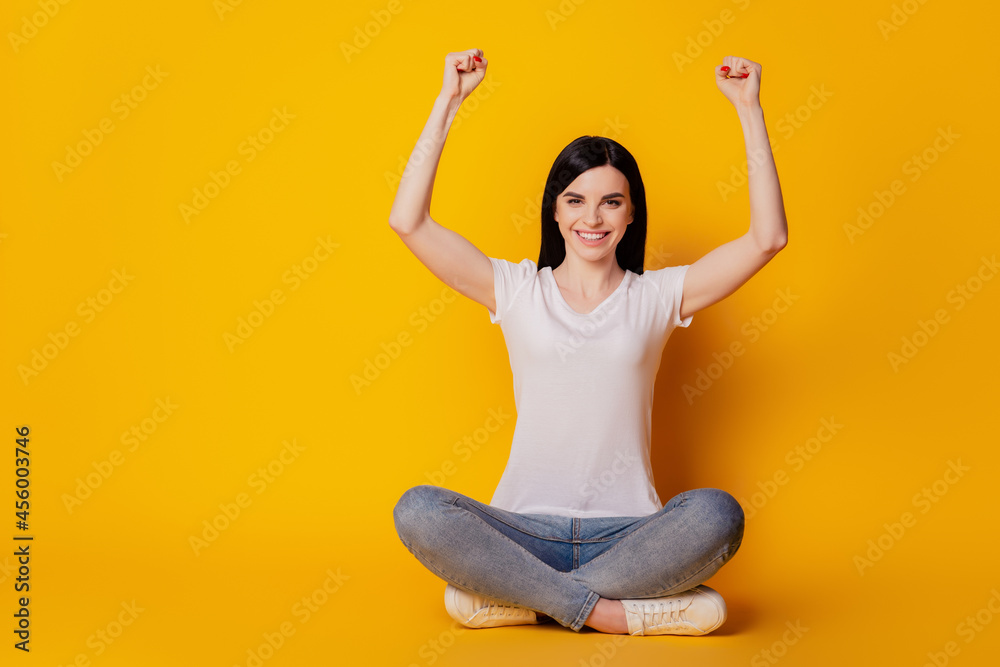 Full length photo of crazy funky girl celebrate victory raise fists scream yeah isolated over vivid color background Full length photo of crazy funky girl celebrate victory raise fists scream yeah isolated over vivid color background