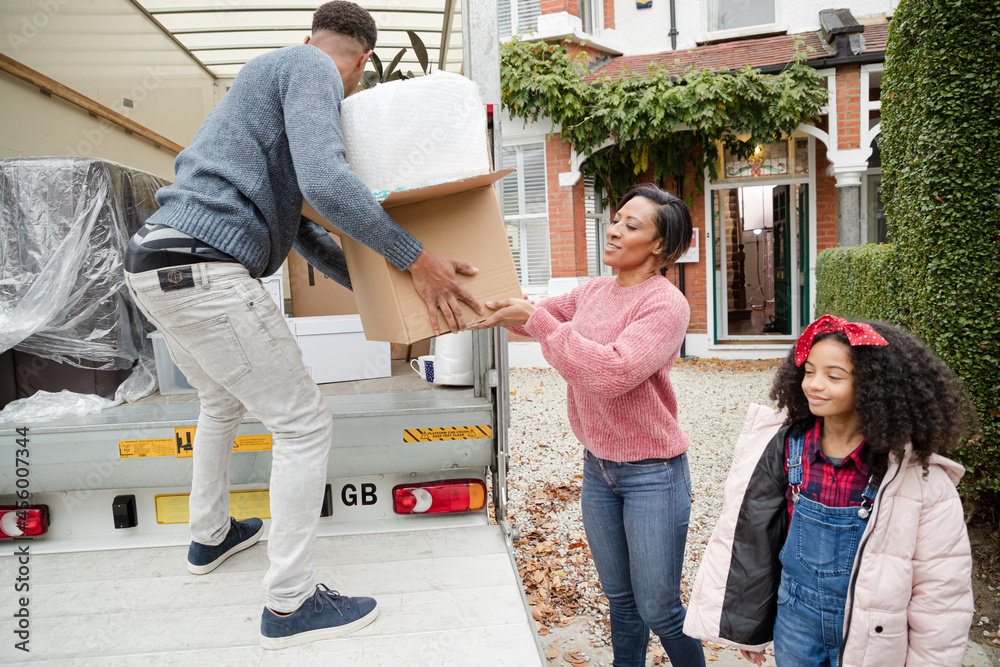 Family moving, loading moving van Family moving, loading moving van