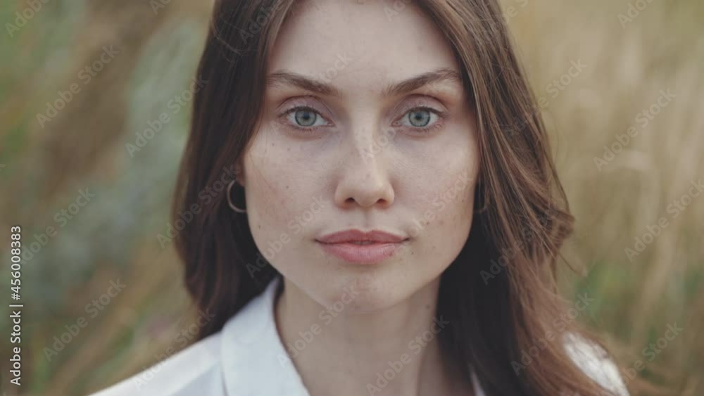 Portrait of young woman with natural beauty posing on field Portrait of young woman with natural beauty posing on field
