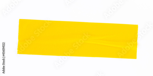 yellow tape on white background. Torn horizontal and different size yellow sticky tape, adhesive pieces.