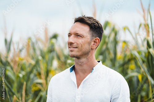 Unshaven man in countryside field in daytime photo