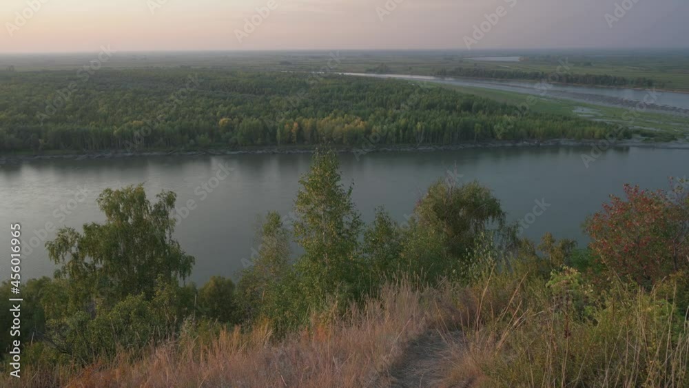 Siberian Ob river, river bank in beauty summer evening, 4K drone footage. Siberian Ob river, river bank in beauty summer evening, 4K drone footage.