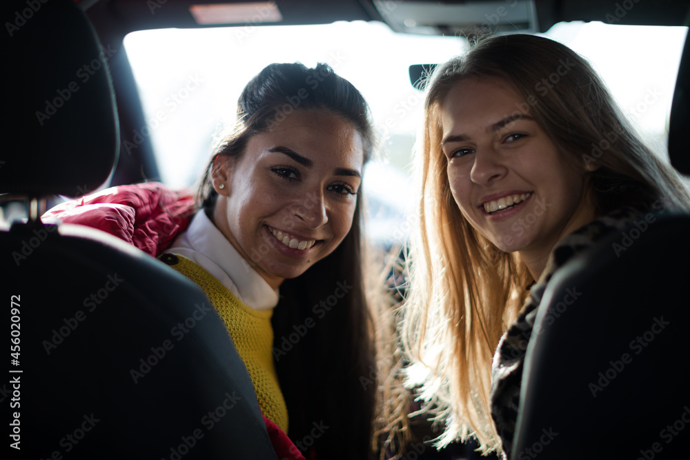 Portrait happy, playful young women in car