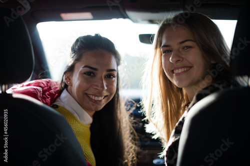Portrait happy, playful young women in car © KOTO
