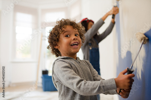 Fotografija Happy children painting wall