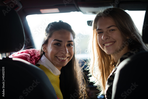 Portrait happy, playful young women in car