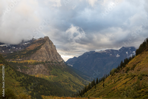 Storm clouds over mountains and valley in Glacier National Park  Montana  USA