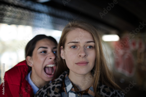 Angry young woman yelling at friend © KOTO