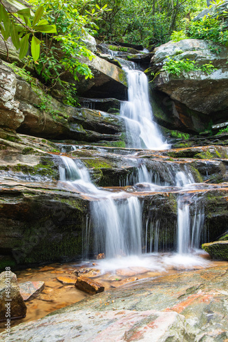 Water Fall Flowing Over Moss Covered Rocks