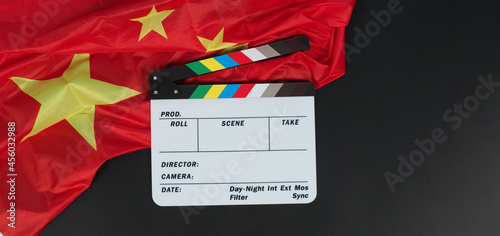 Obraz na płótnie China flag and clapperboard onblack background.