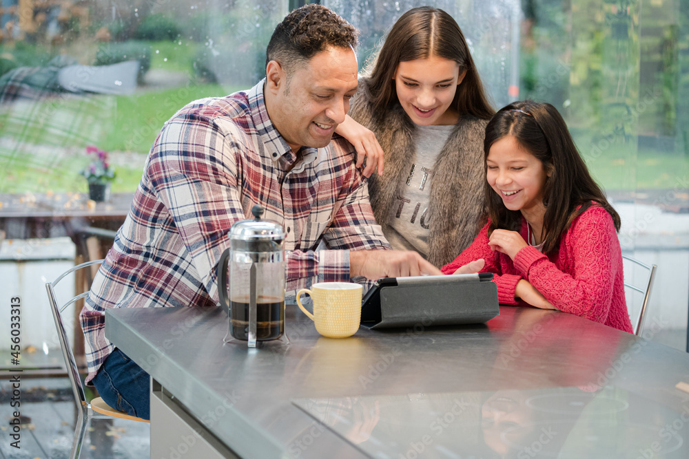 custom made wallpaper toronto digitalFather and daughters using digital tablet in morning kitchen
