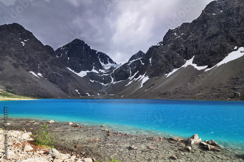 The glacial lake Blåisvatnet or Blåvatnet, below the glacier Lenangsbreen, in the Lyngen alps, Troms og Finnmark county, Norway. photo