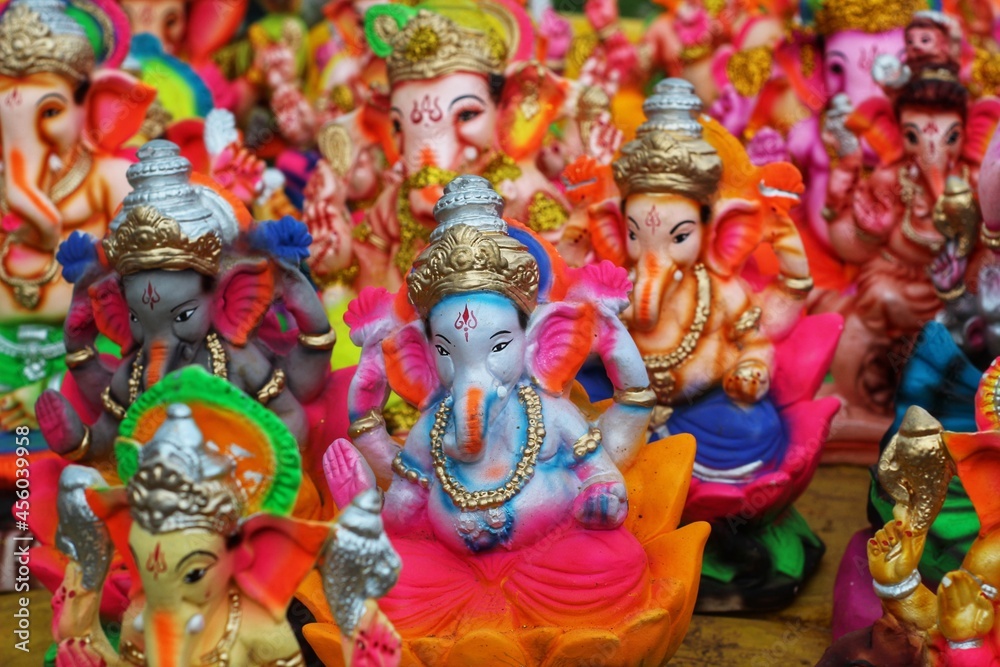 lots of lord ganesh idol arranged beautifully for celebration of ganesh chaturthi in india from different angle view