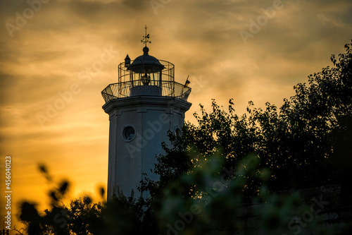 Tower of the old lighthouse against the evening sky 