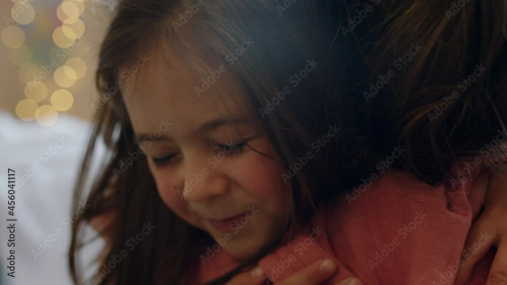 happy little girl hugging mother enjoying loving mom embracing daughter at home 4k footage happy little girl hugging mother enjoying loving mom embracing daughter at home 4k footage