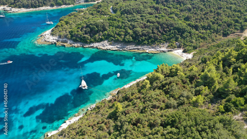 Aerial drone photo of small marina and sandy beach in island of Antipaxos, Ionian, Greece